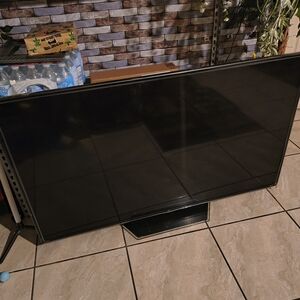 Black Flat-Screen TV with Stand - Unbranded